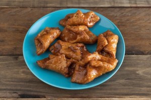 a plate of food pestiños on a table