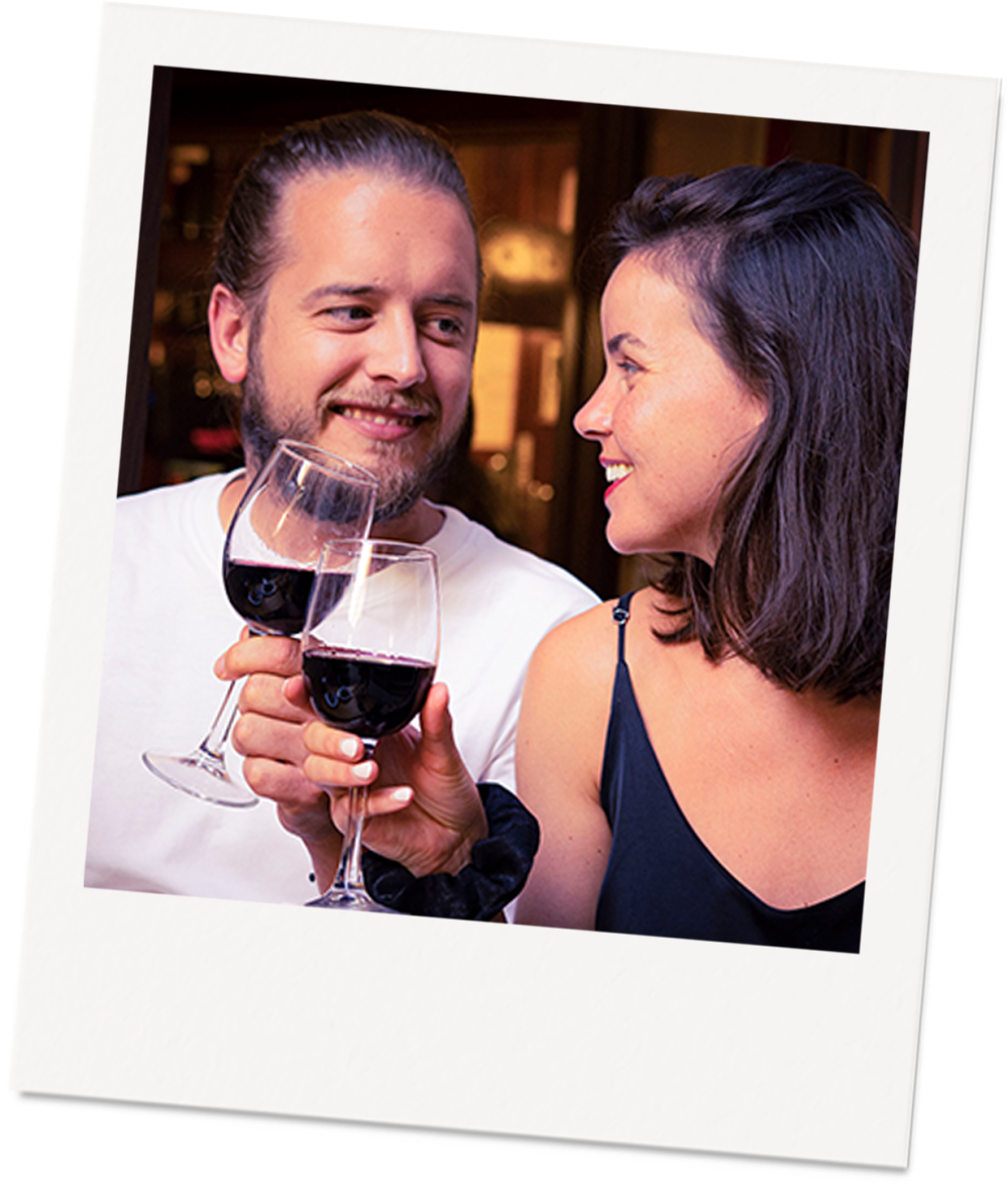 1257-www.kzaravisual.com_ a person holding a glass of wine