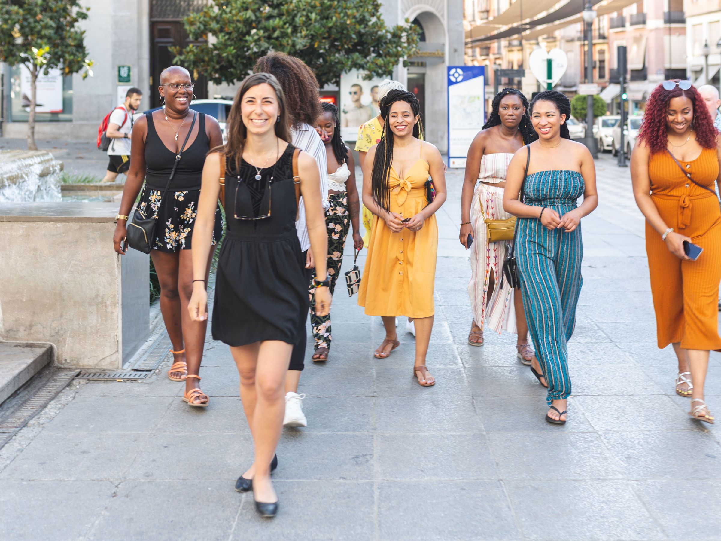 Kara Miller et al. walking on a sidewalk