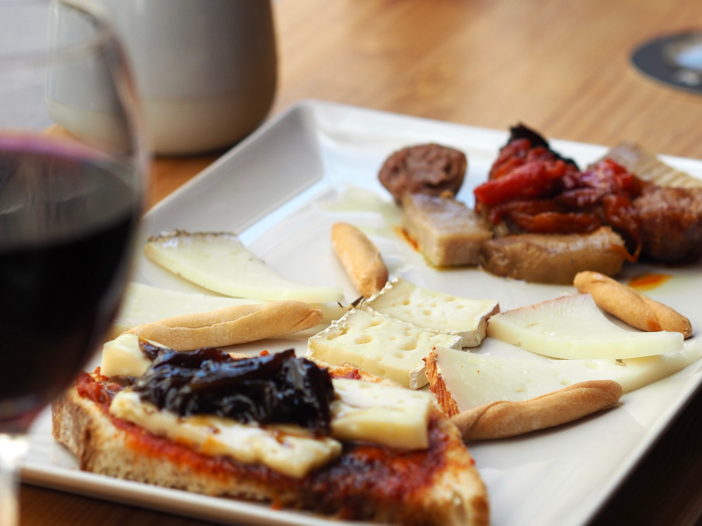 a plate of food sitting on top of a wooden table