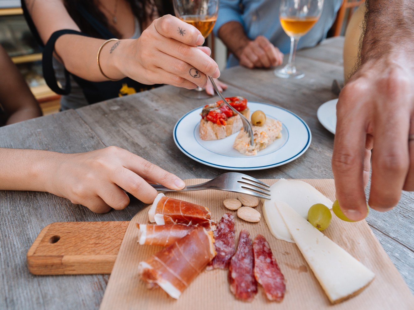 a sandwich sitting on top of a wooden cutting board