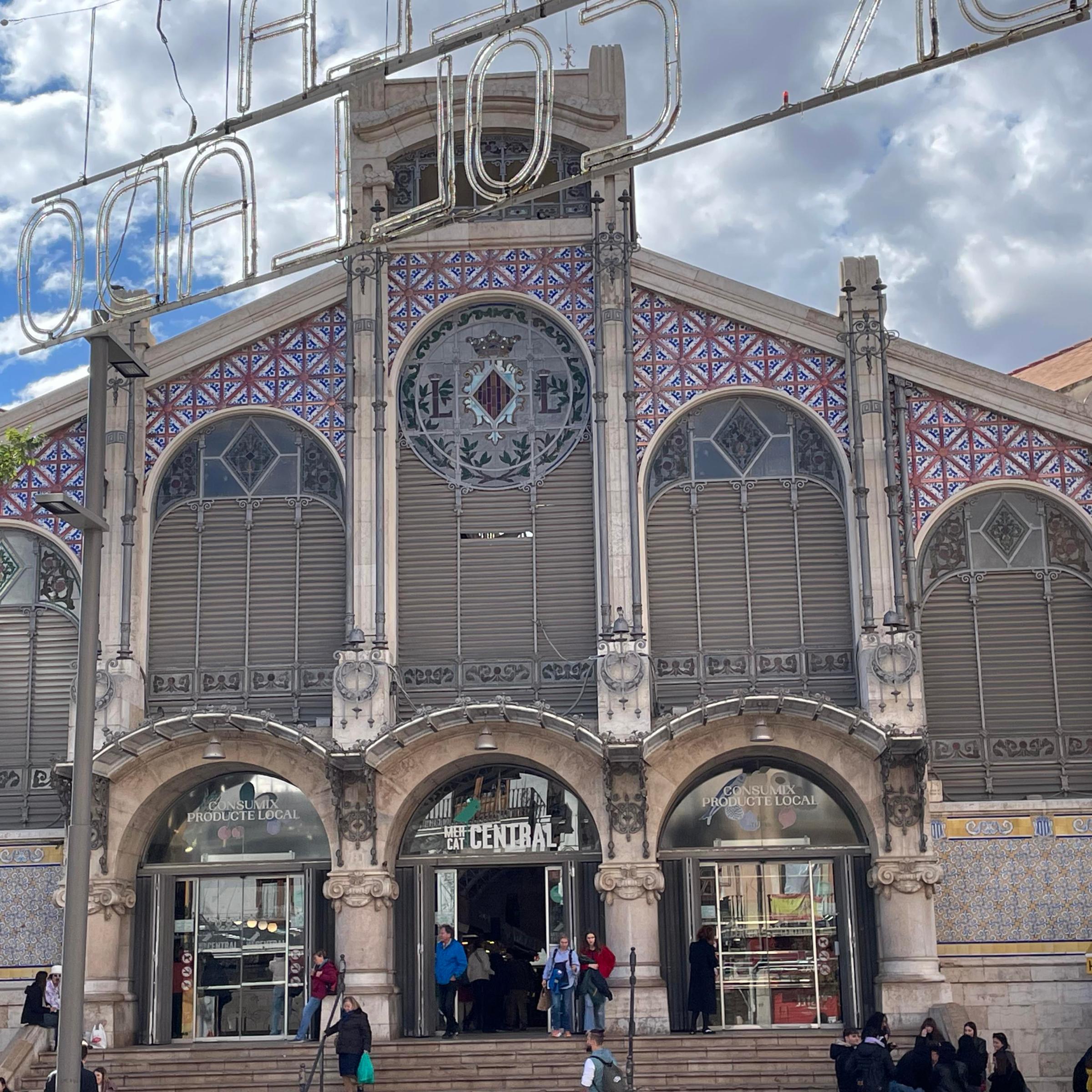 a group of people standing in front of a building
