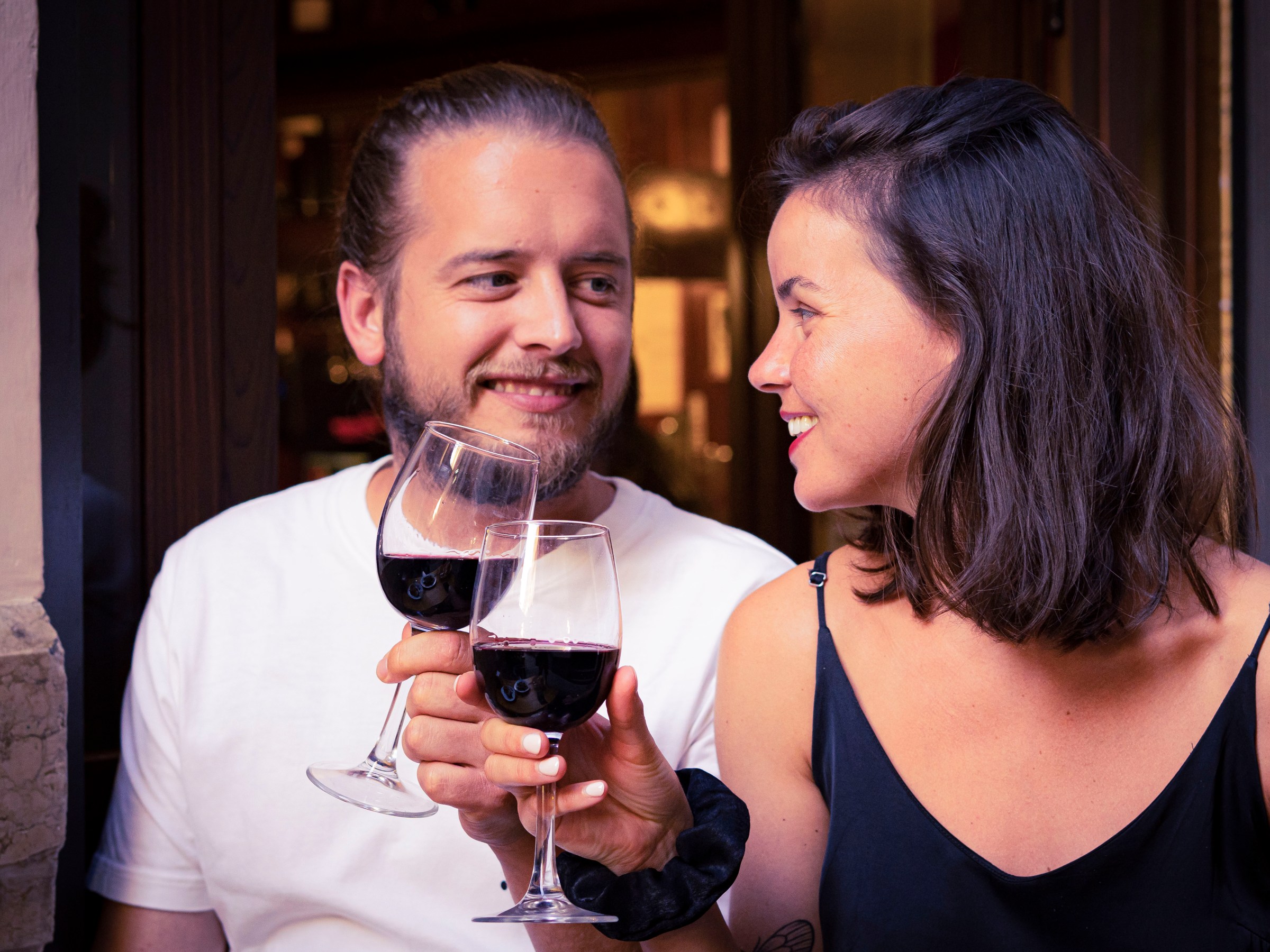 a person holding a wine glass