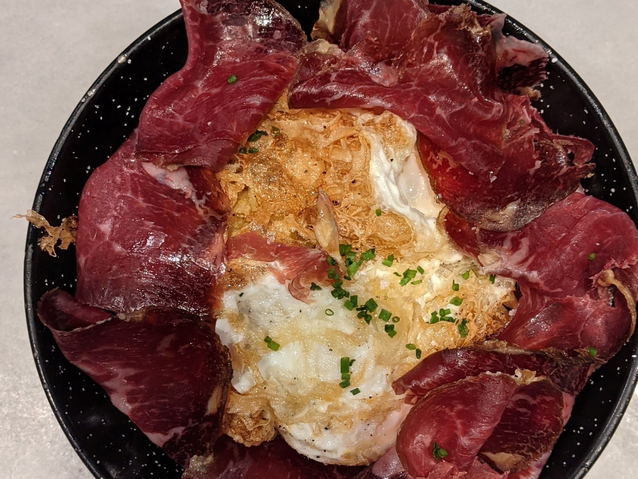 a plate of food with a slice of pizza