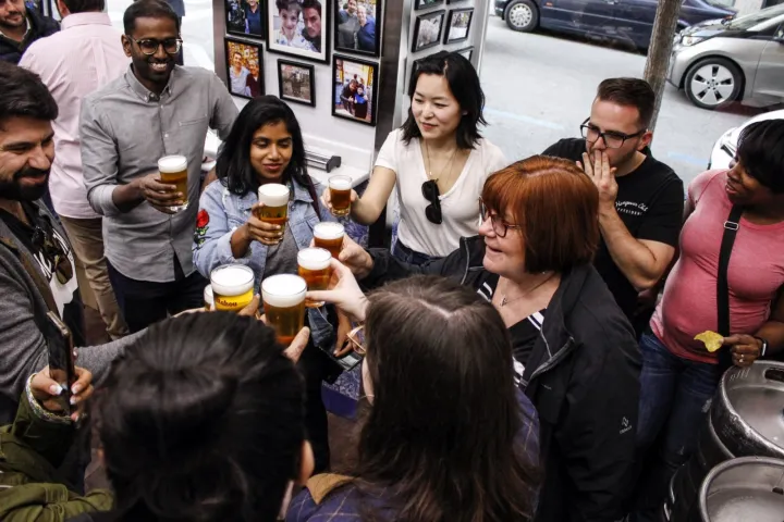 Randy Jackson et al. standing in front of a crowd