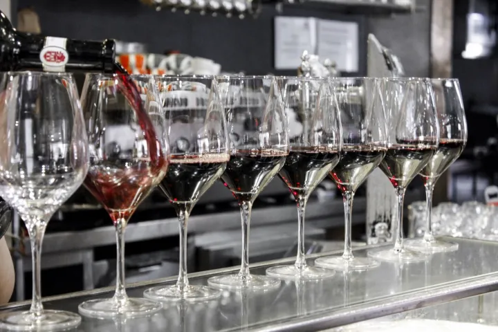 a table filled with wine glasses