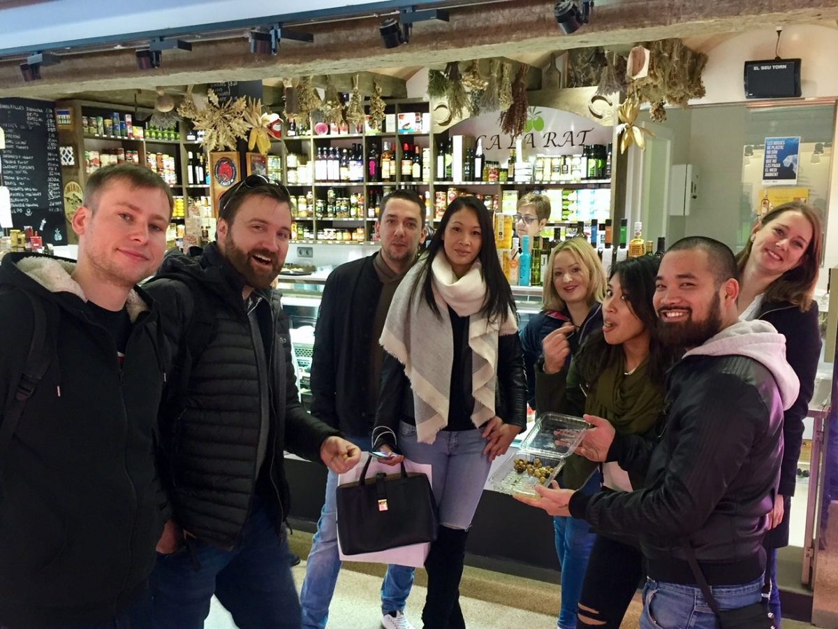 a group of people standing in front of a store