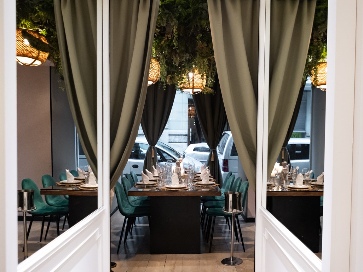 a living room filled with furniture and a large window