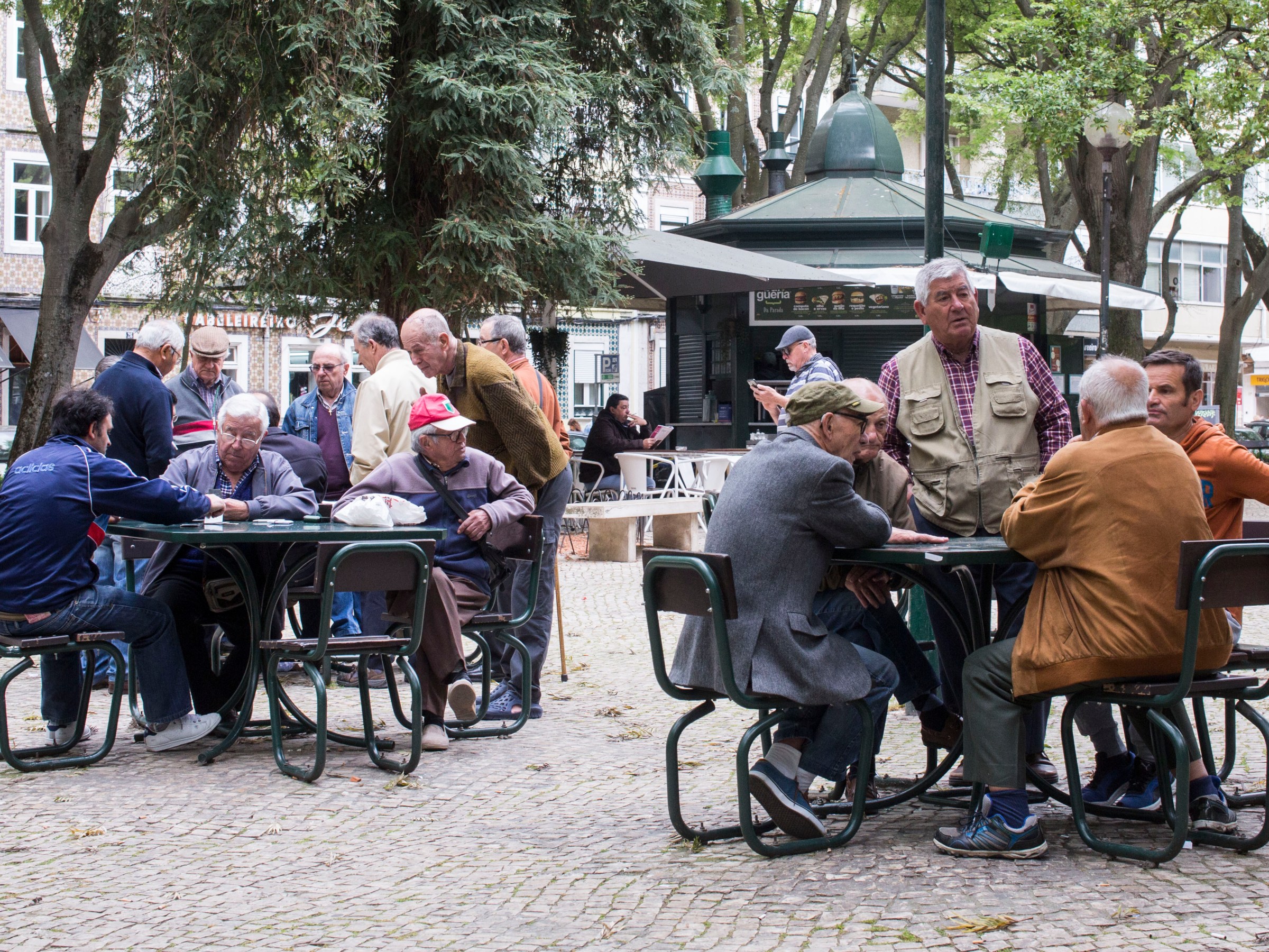 a group of people sitting on a bench