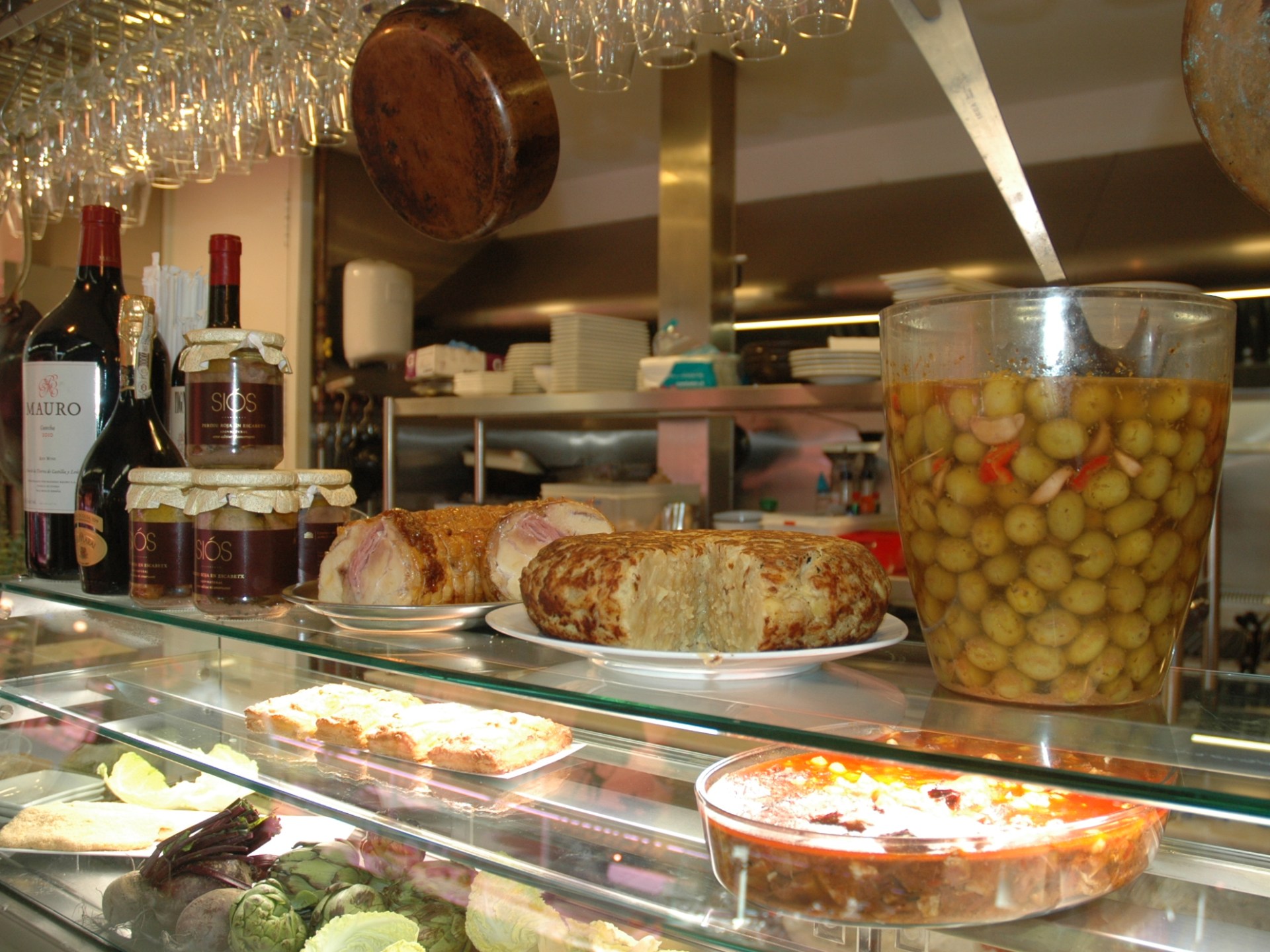 a plate of food and a glass display case