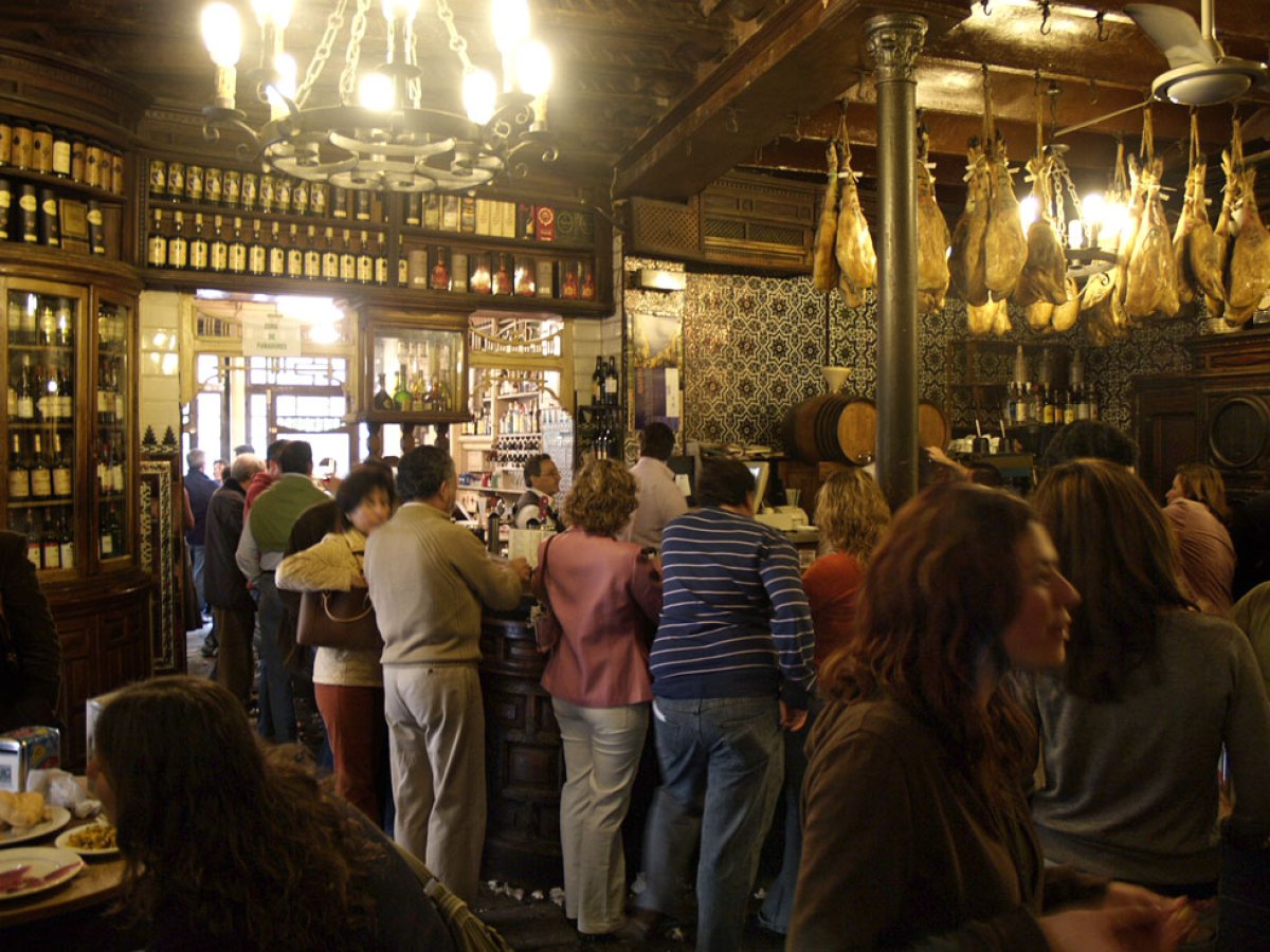 a group of people standing in front of a store