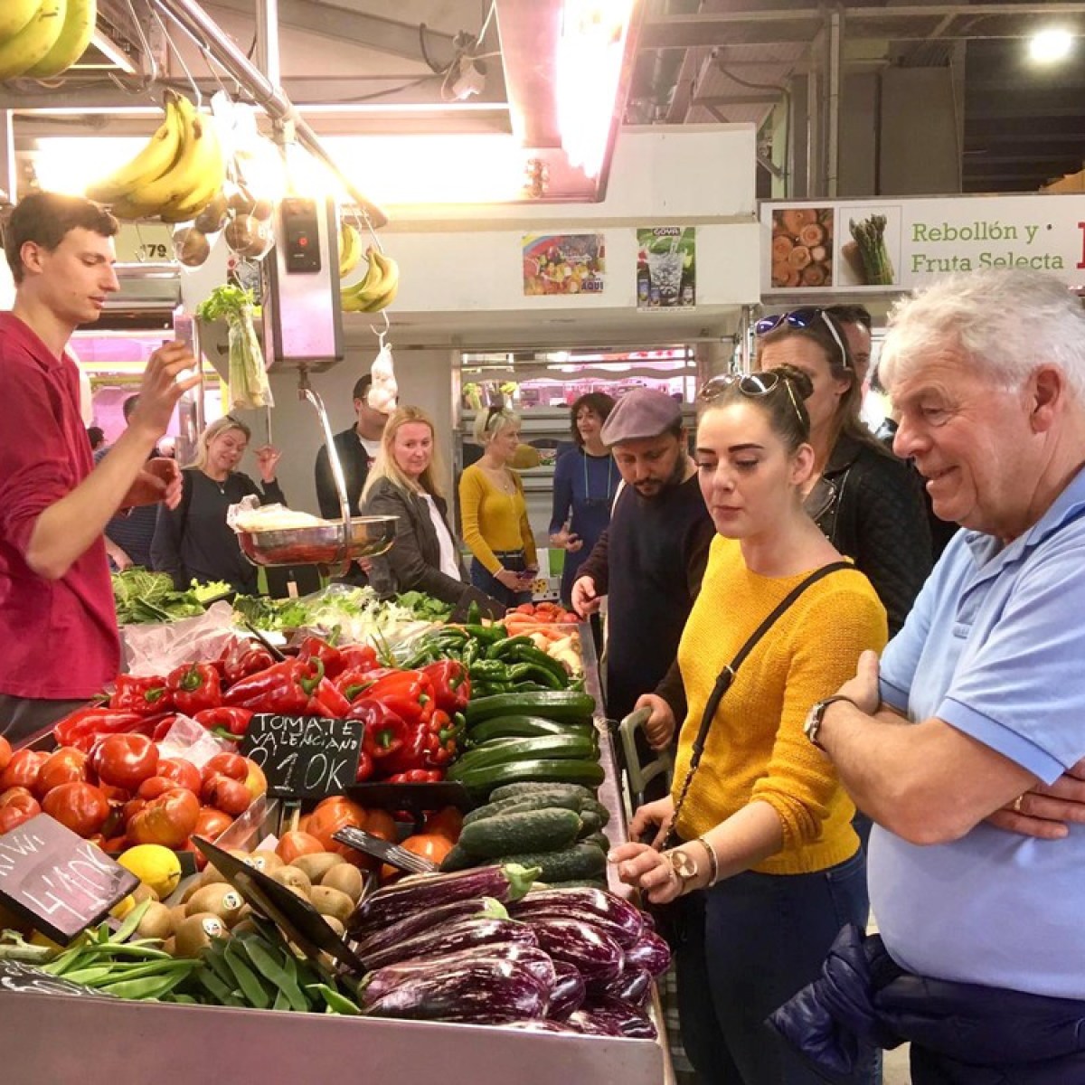 a group of people standing in front of a store