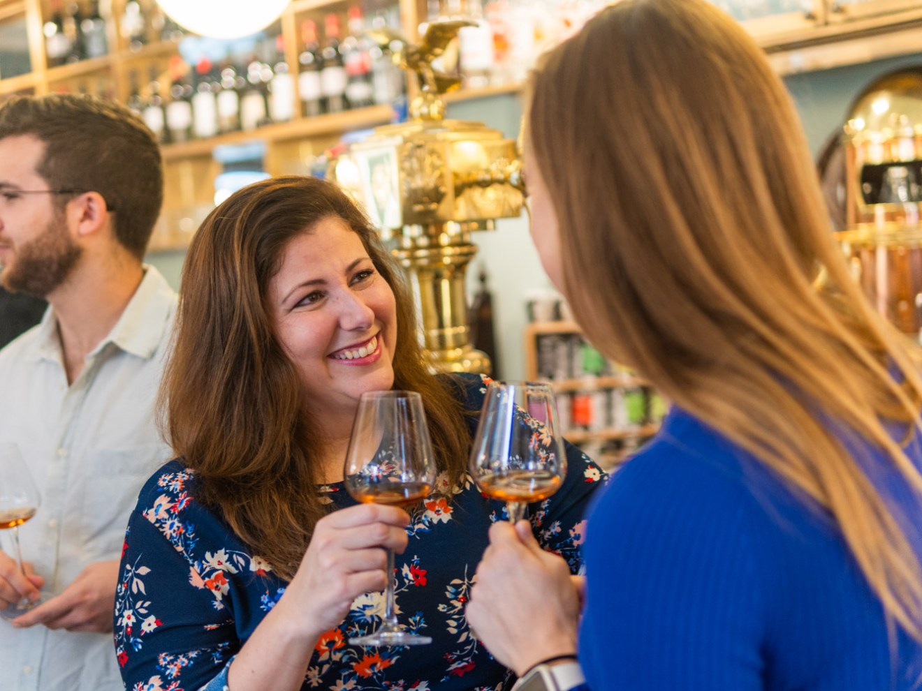 a group of people holding wine glasses