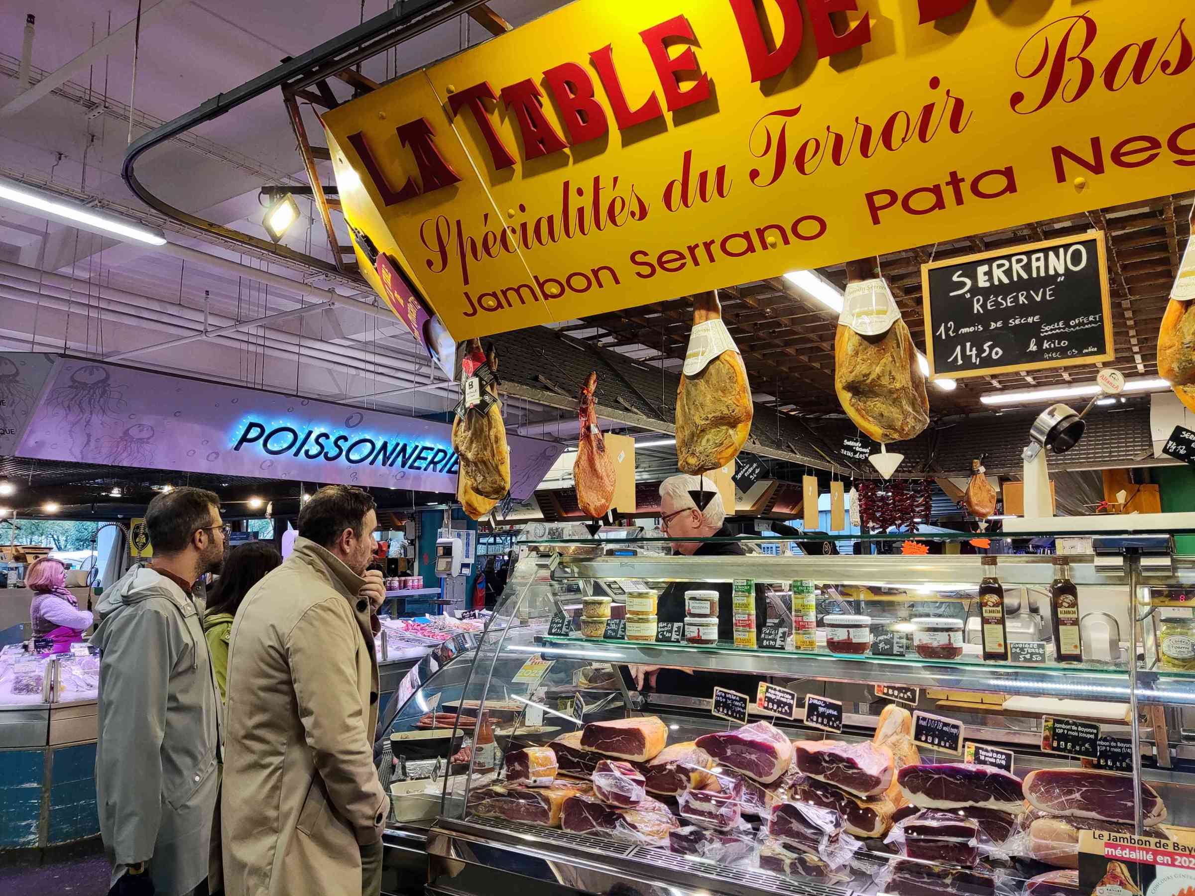 a group of people standing in front of a store