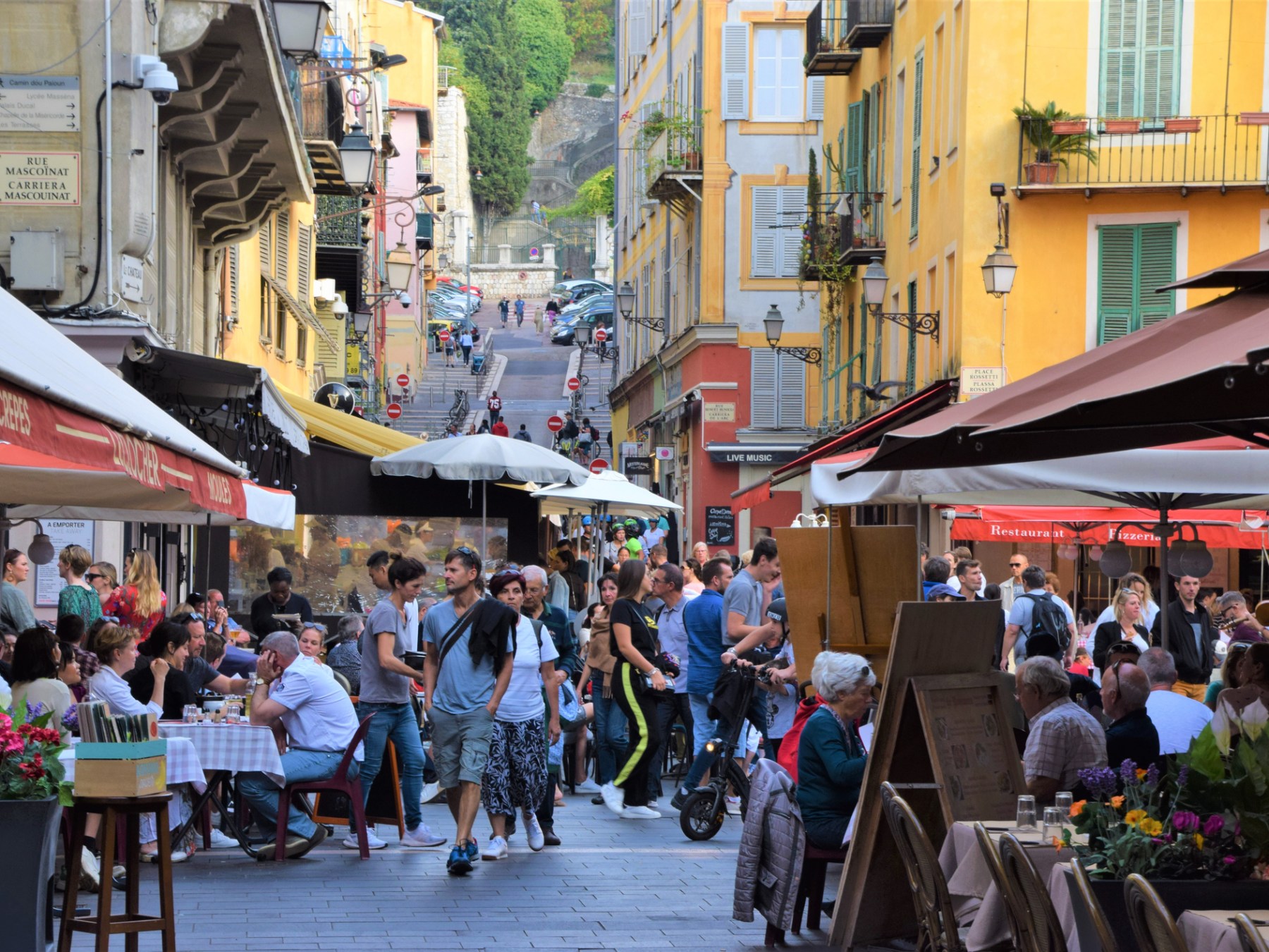 a group of people walking down a street