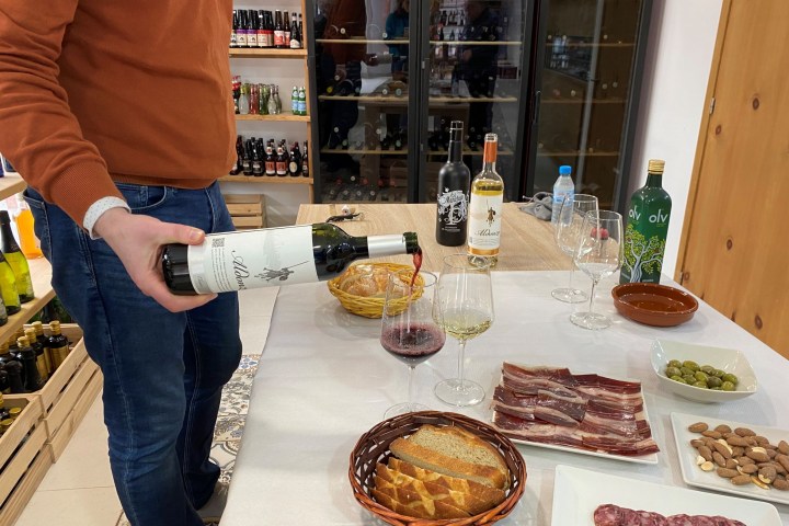 a woman sitting at a table with a plate of food