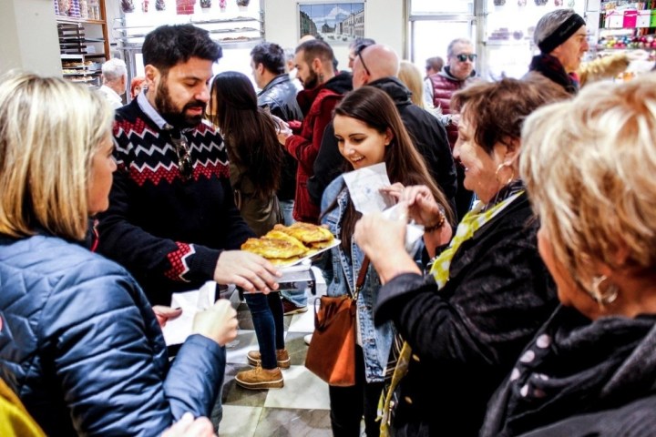 a group of people eating at a restaurant