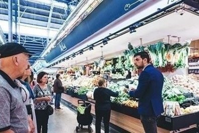 a group of people standing in front of a store