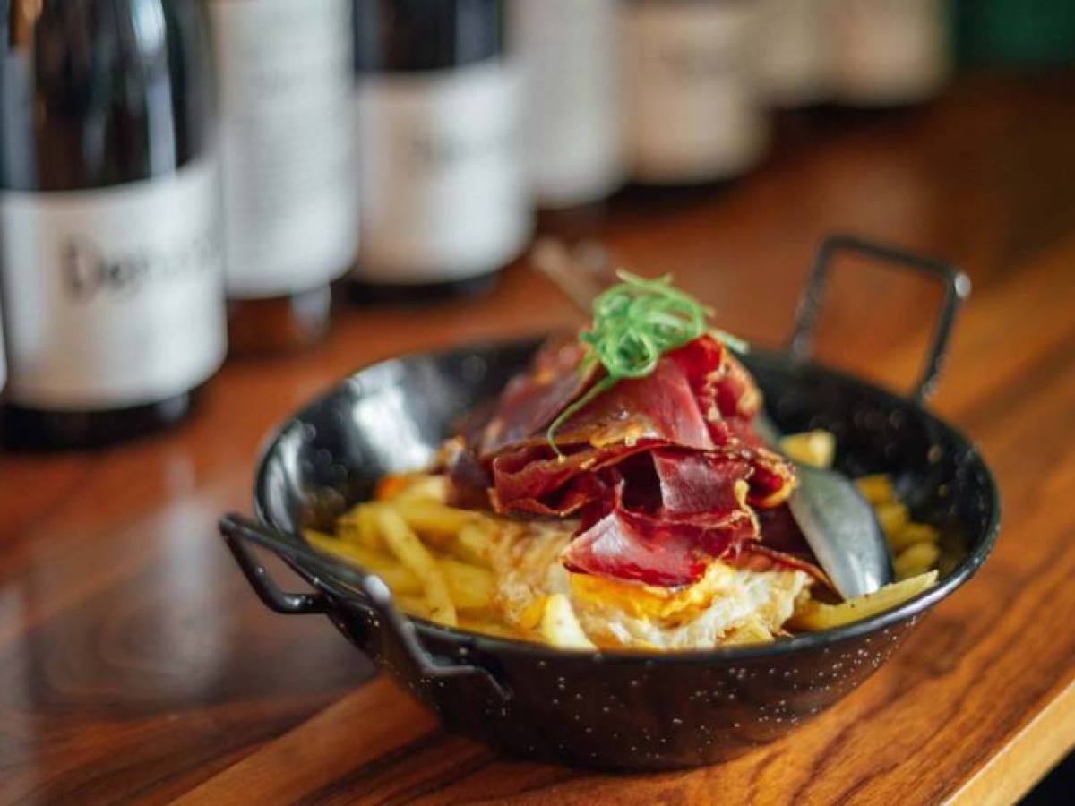 a close up of a bowl of food on a table