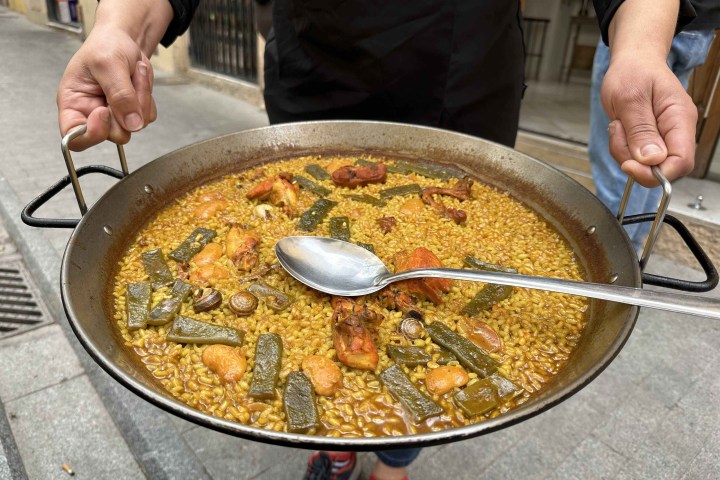 a person preparing food in a pan