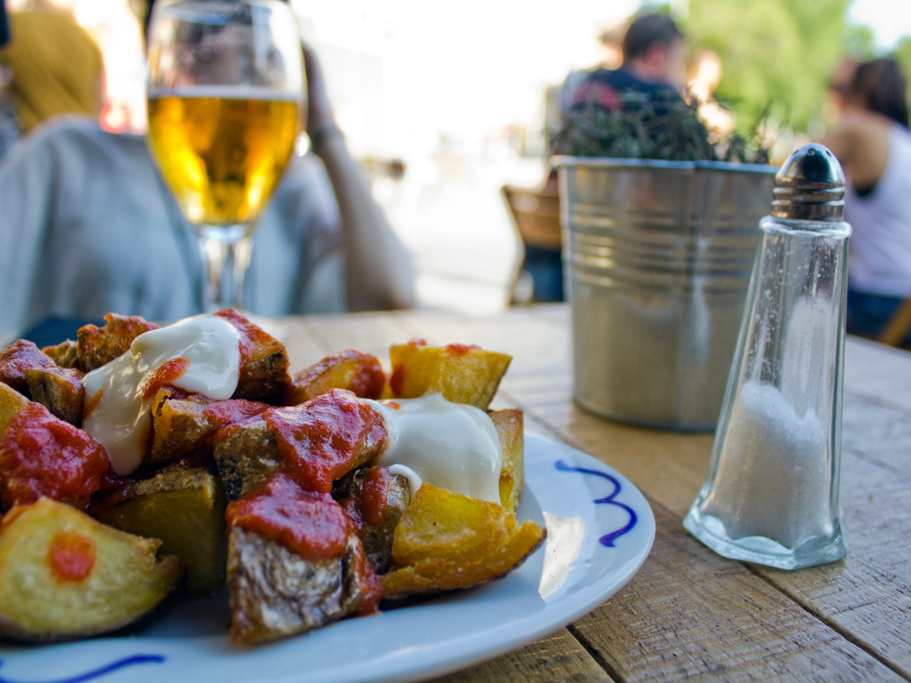 a plate of food and a glass of wine
