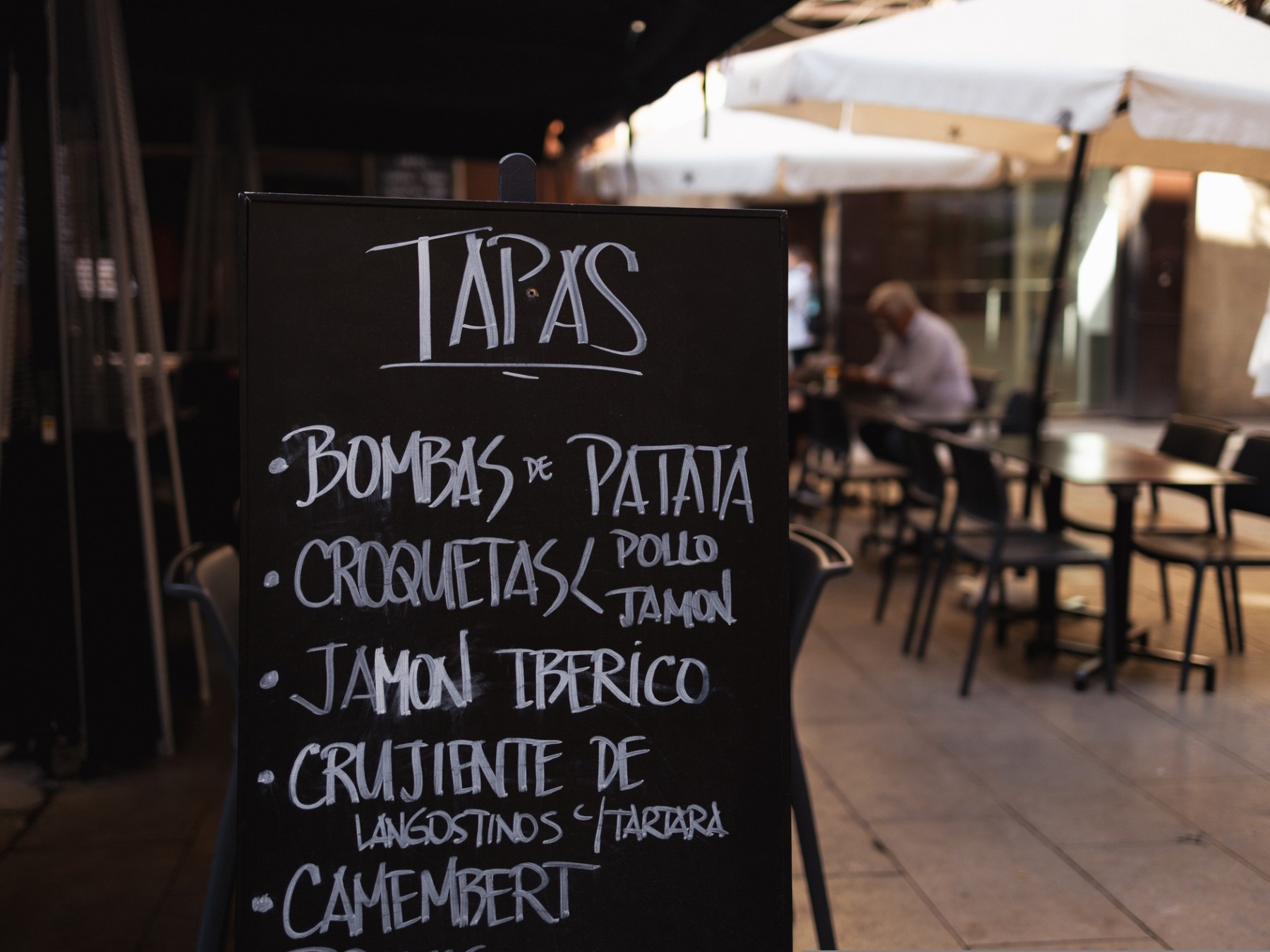 a person standing in front of a sign
