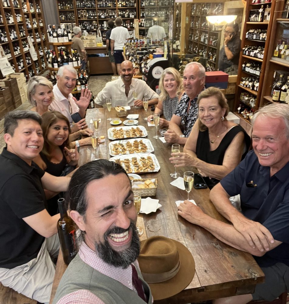 a group of people sitting at a table in a restaurant