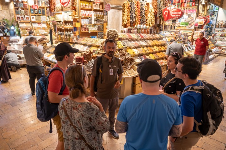 a group of people standing in front of a store