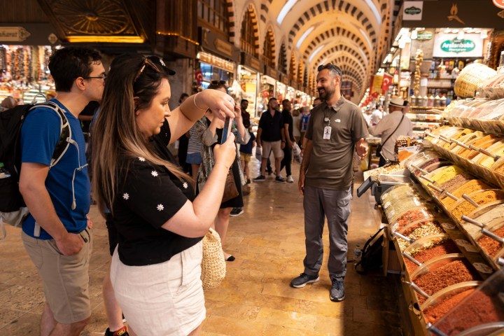 a group of people standing in front of a store