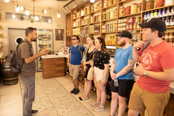 a group of people standing in front of a store