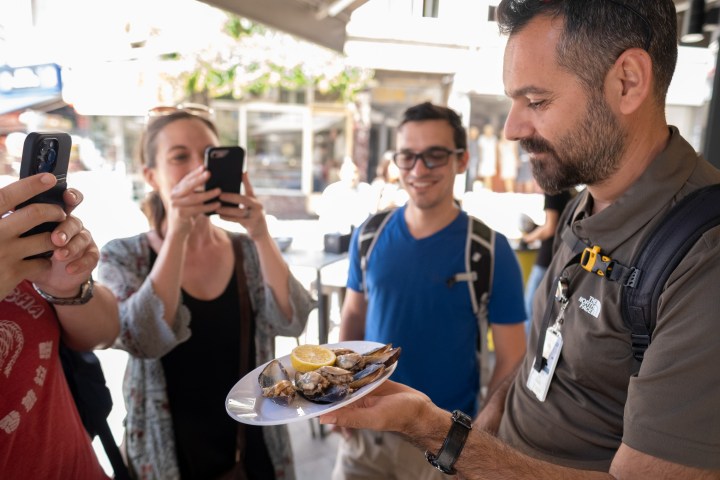 a man holding a glass of wine