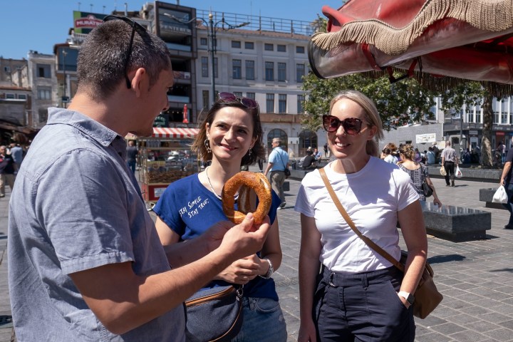 a couple of people that are standing in the street