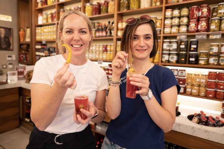 a woman holding a glass of wine