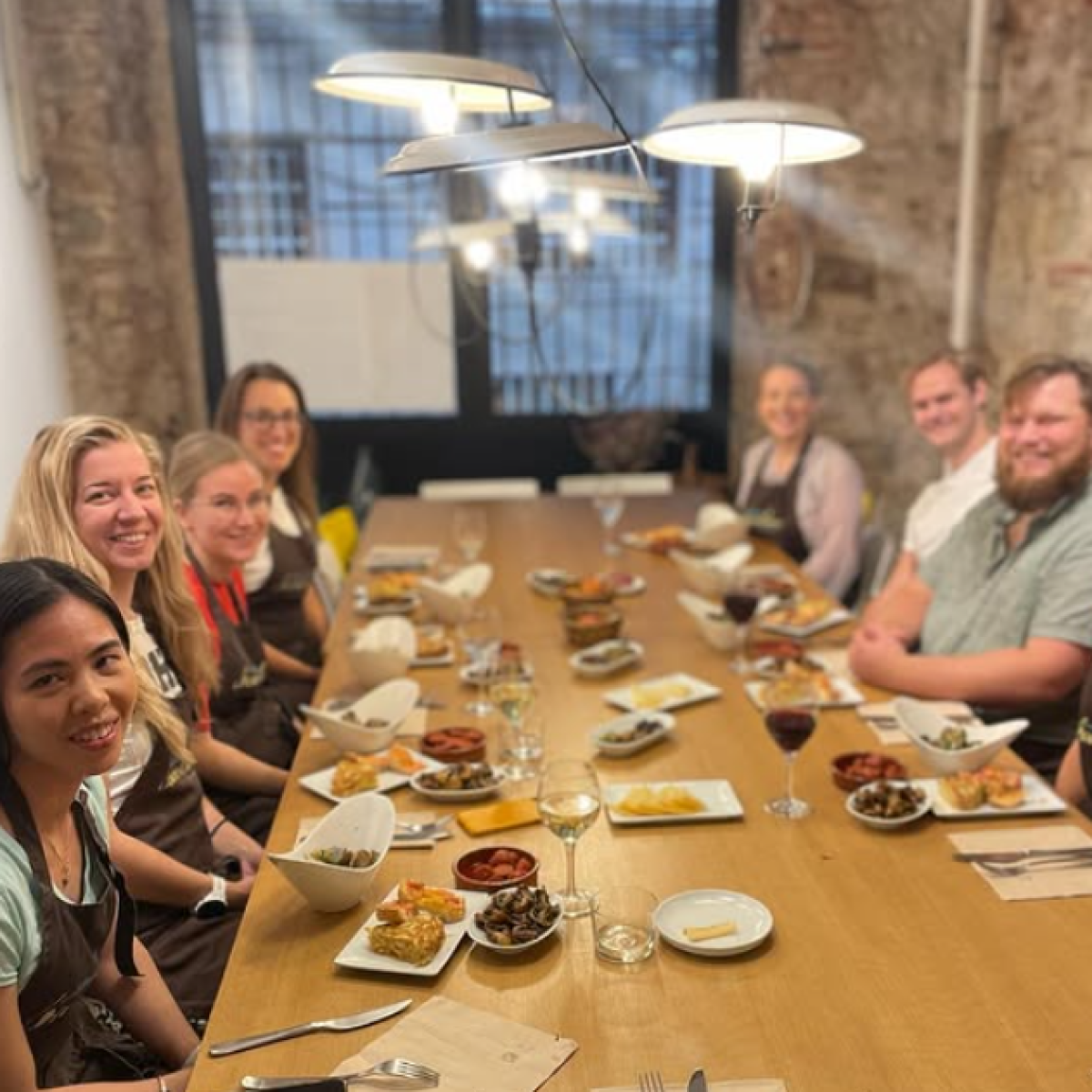 a group of people sitting at a dinner table