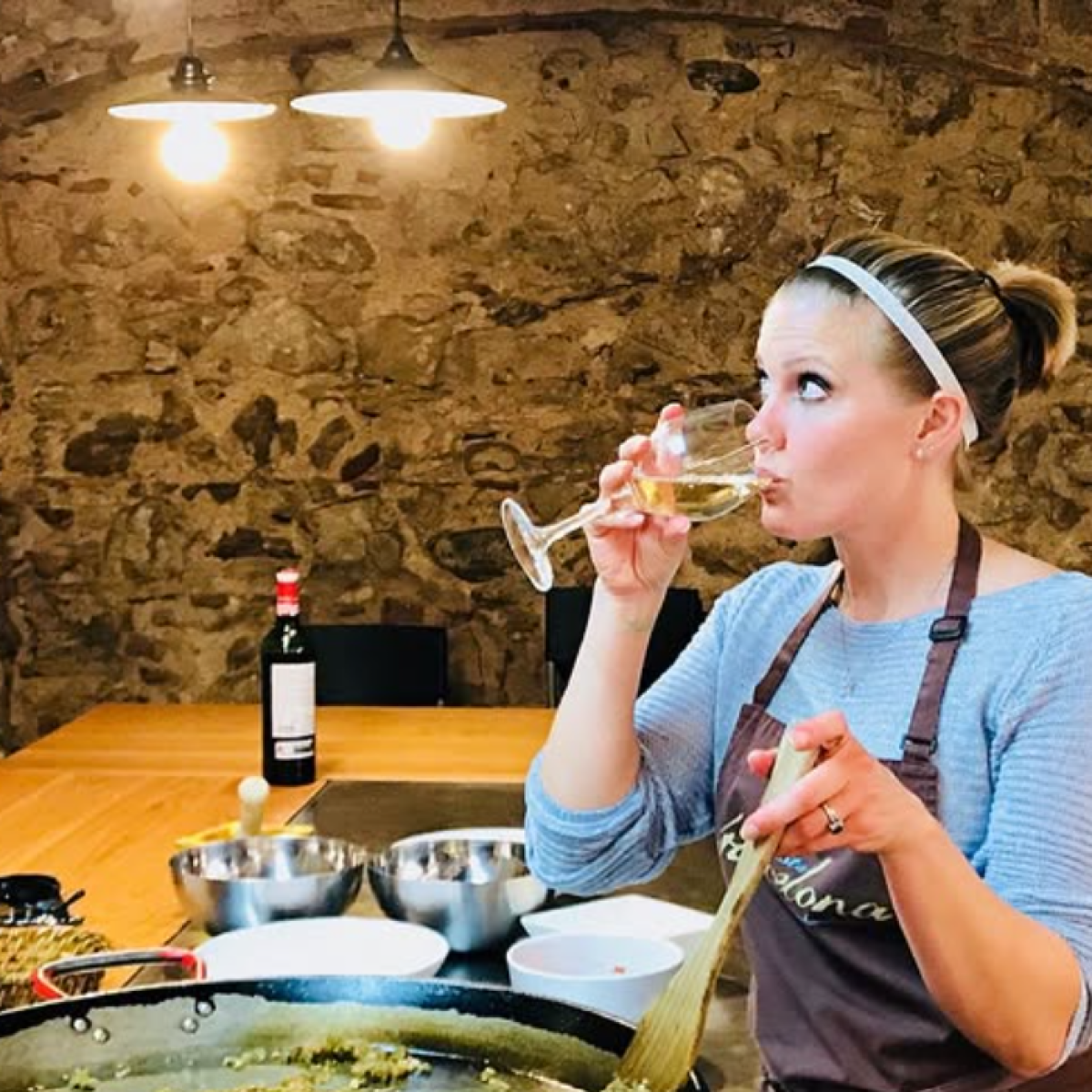 a woman sitting at a table eating food