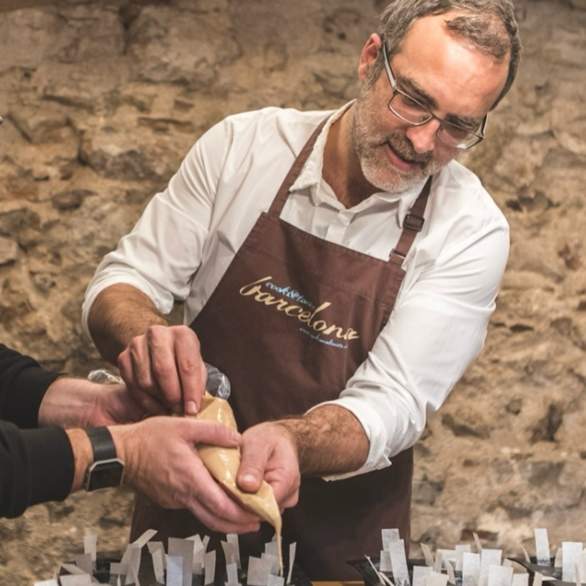 a man cutting a cake