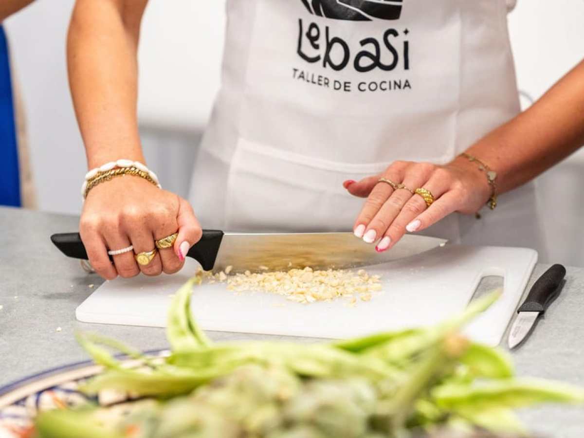 a person preparing food in a bowl on a table
