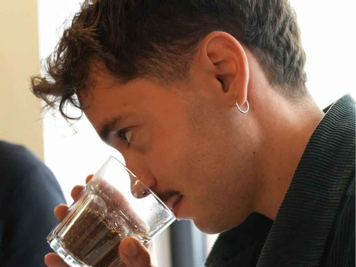 a man drinking from a glass