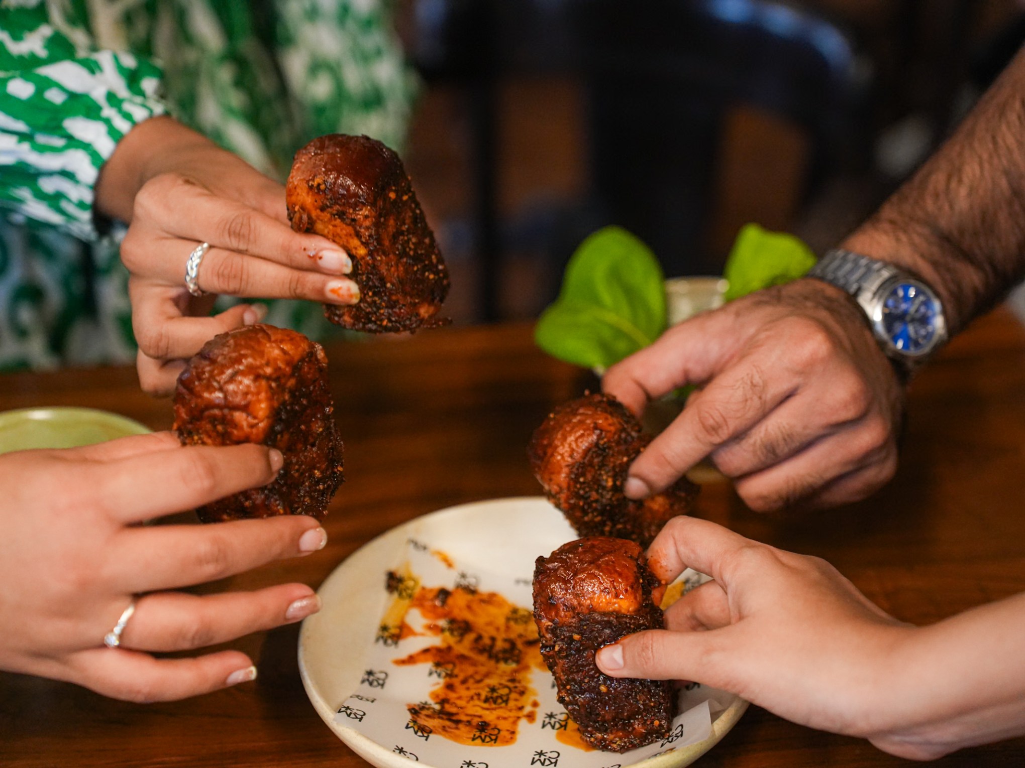 a person cutting food on a plate