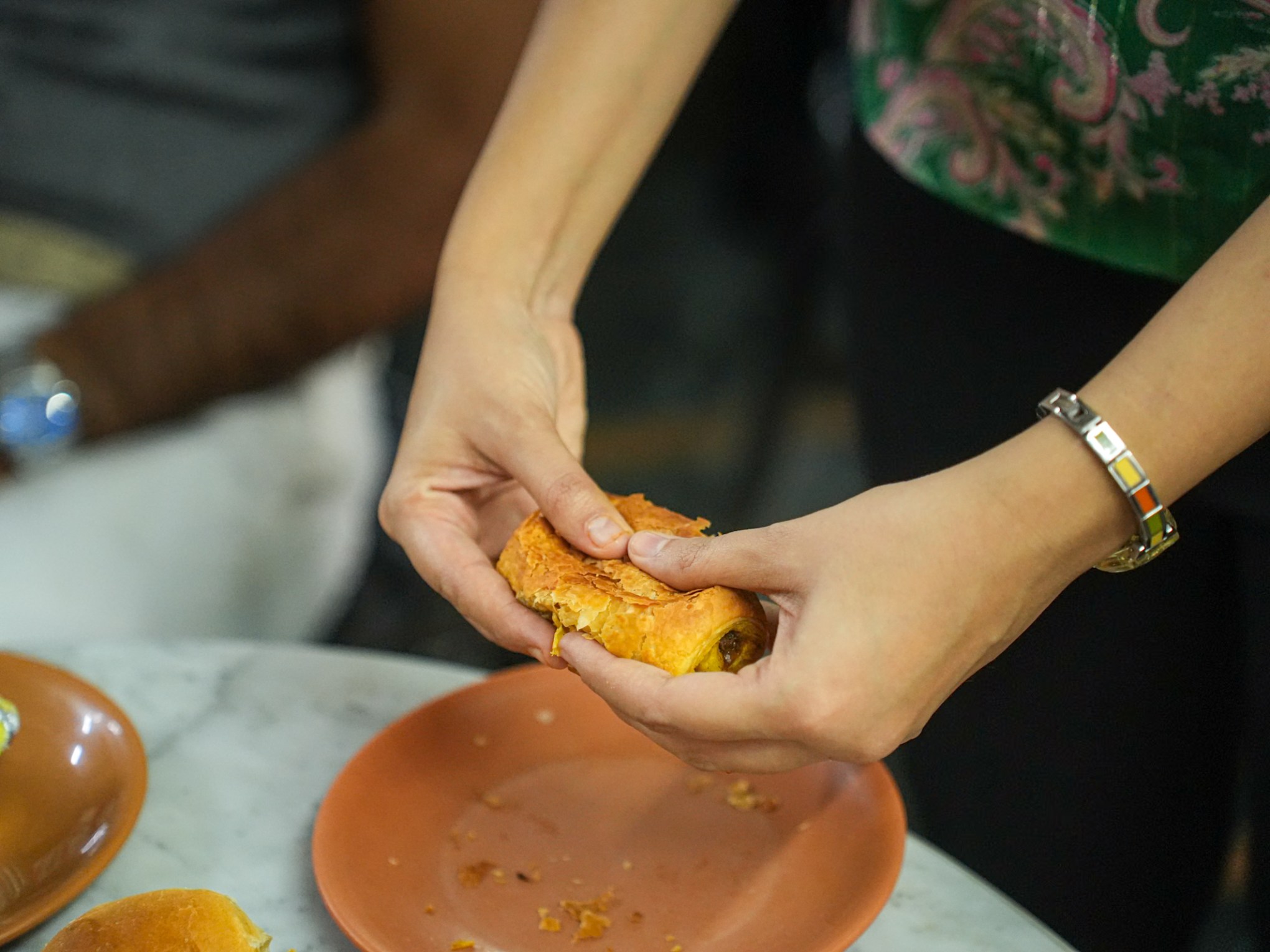 a person holding a plate of food