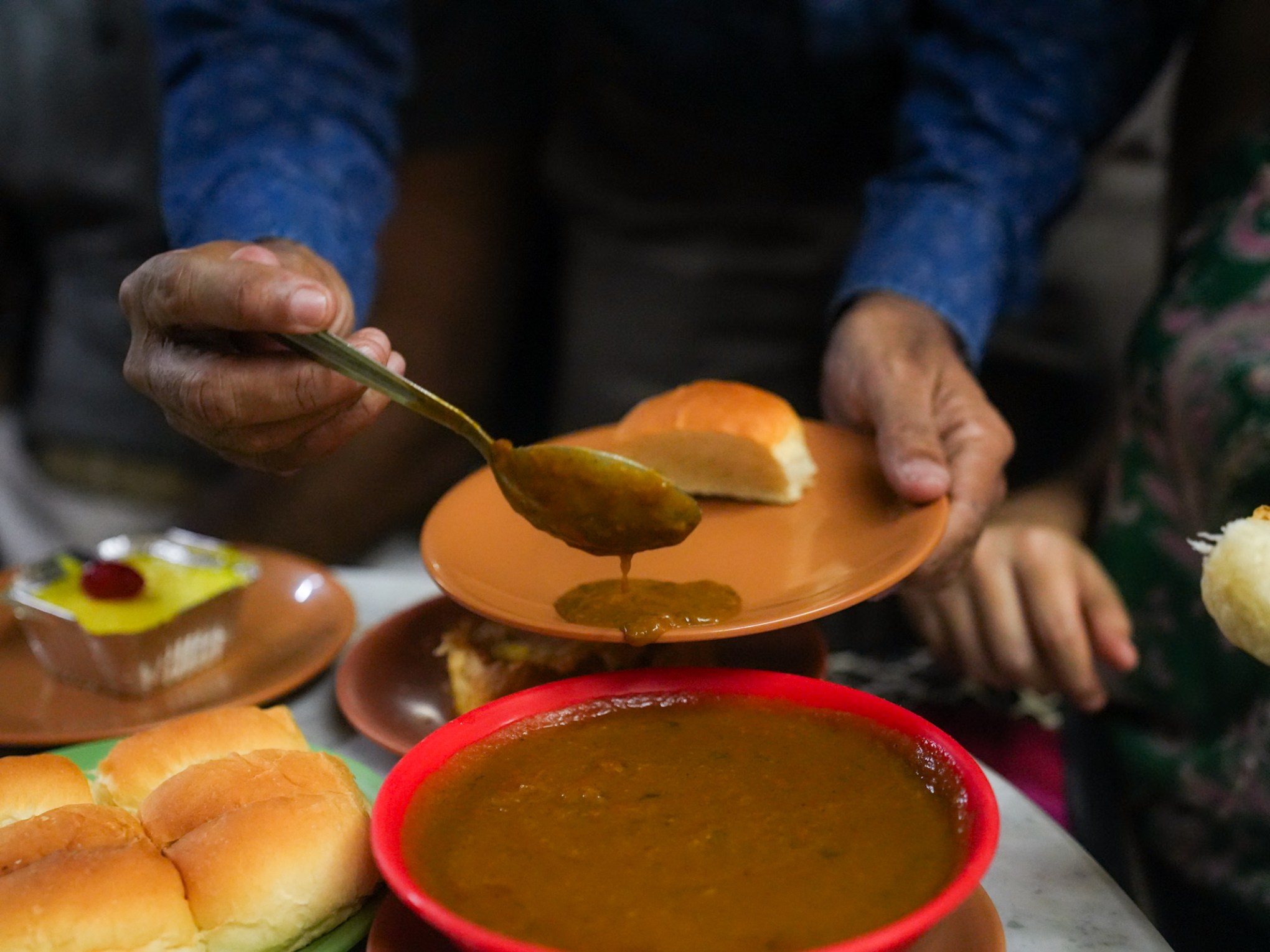 a person holding a bowl of food