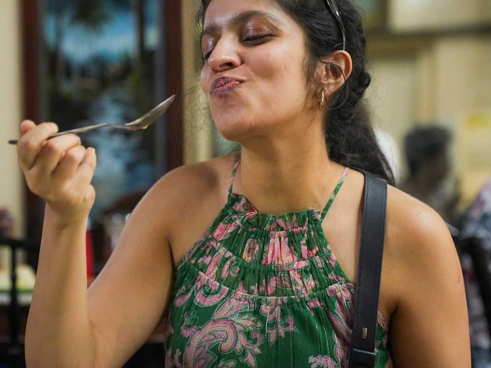 a person sitting at a table eating food