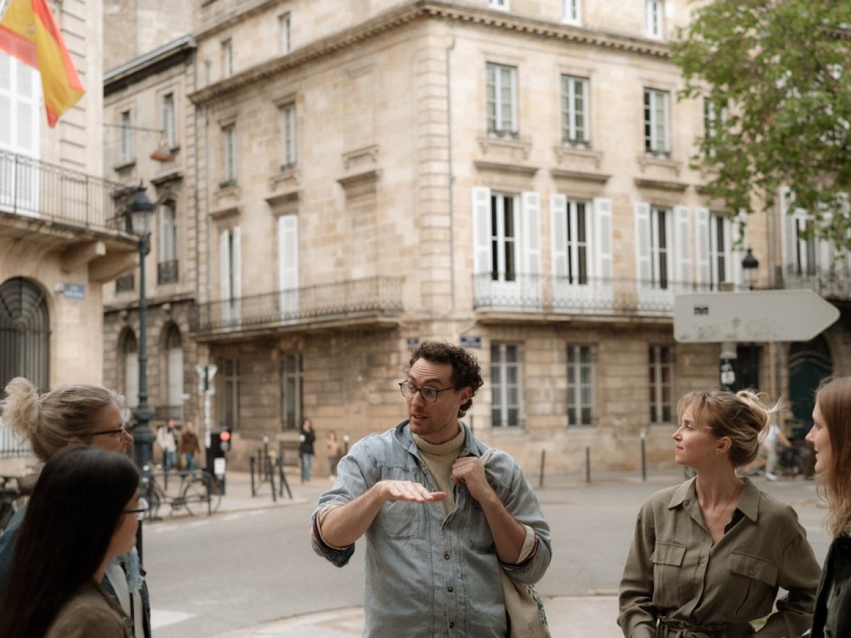 a group of people standing in front of a building