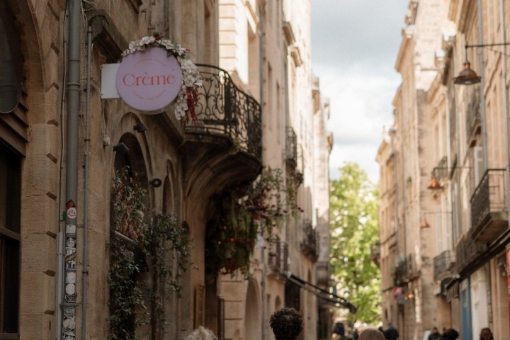 a group of people walking on a city street