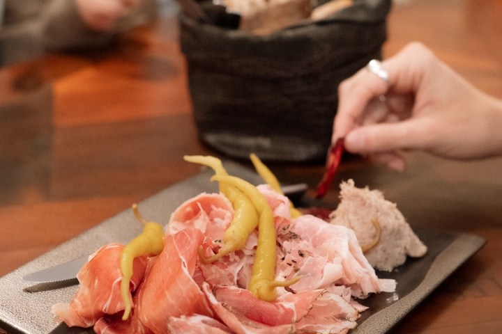 a piece of cake sitting on top of a wooden cutting board