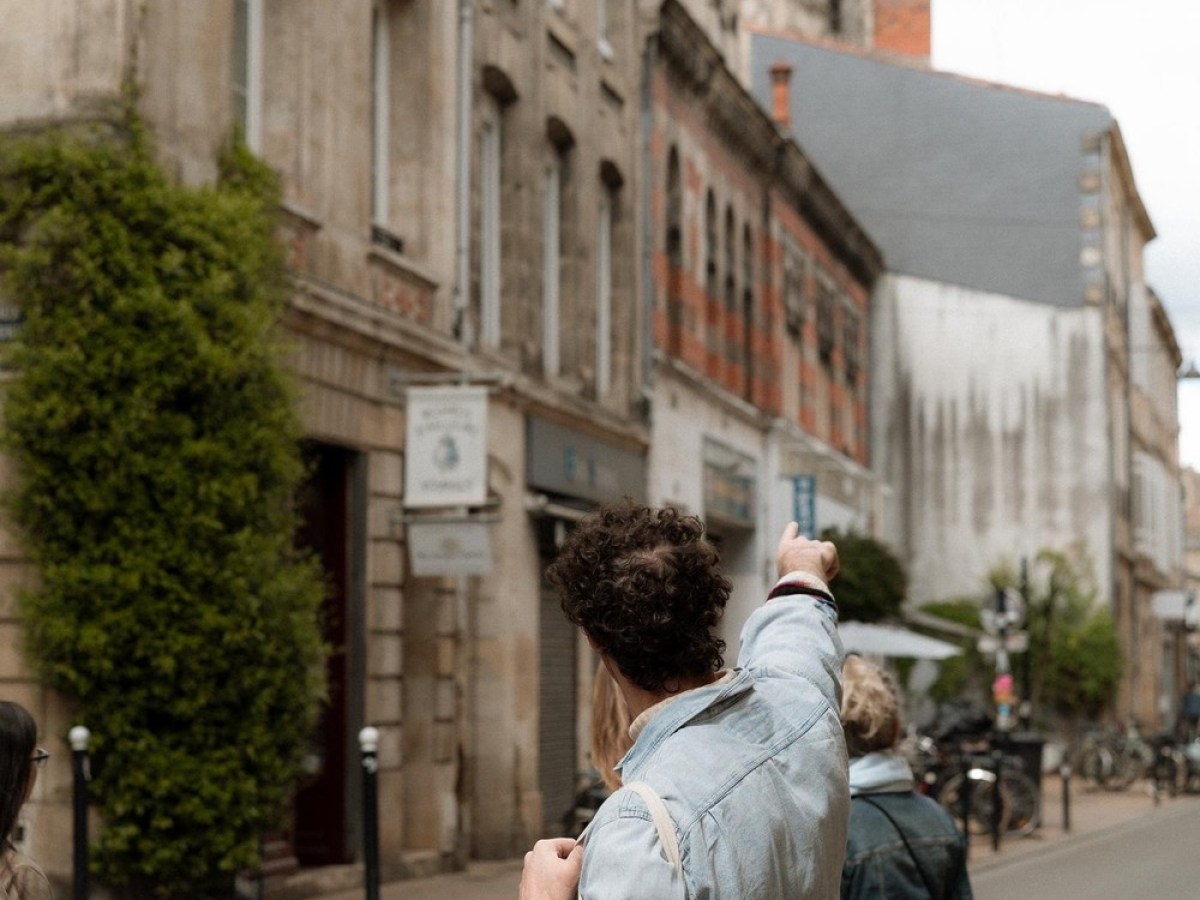 a man and a woman walking down a street